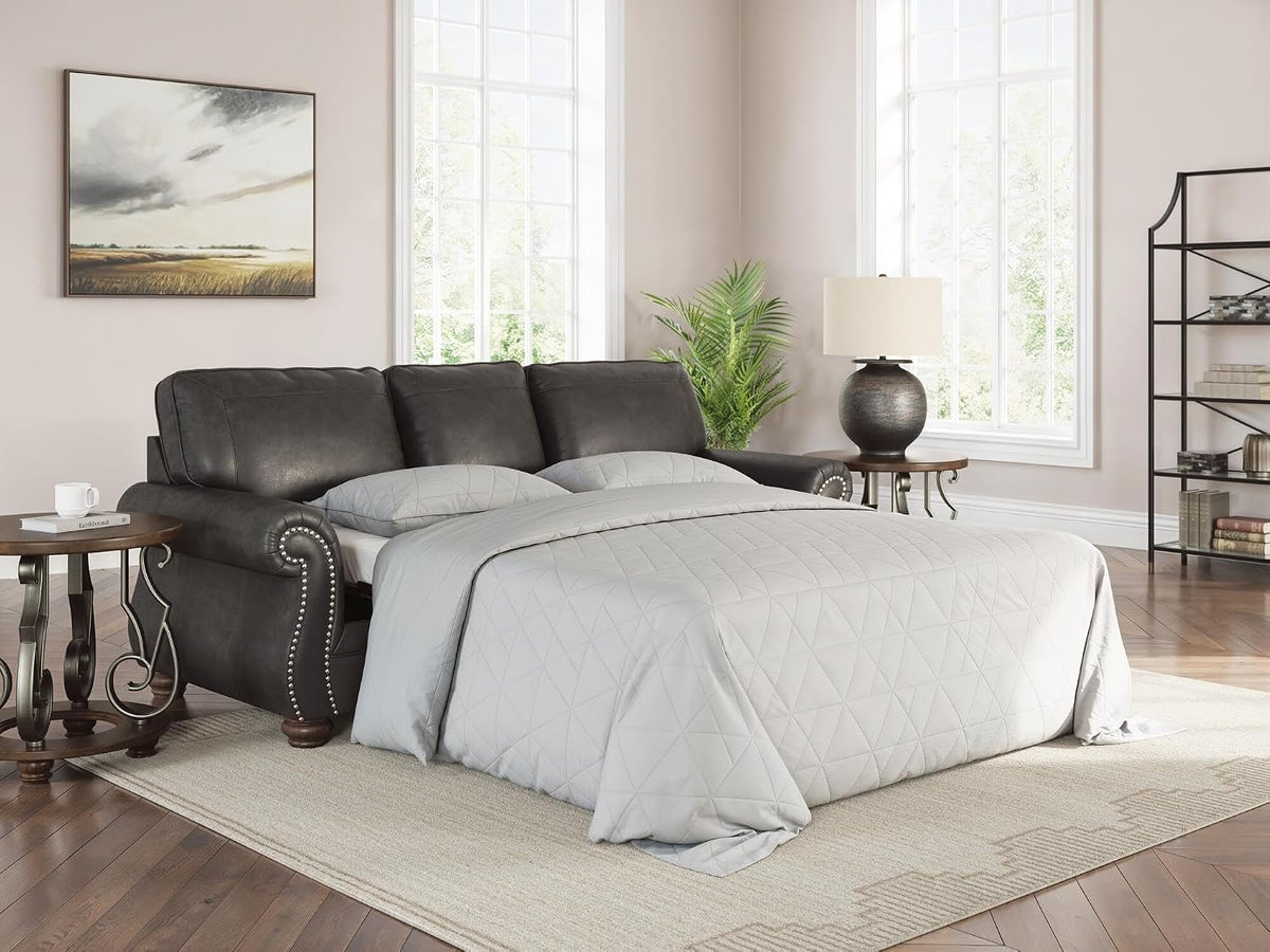 Signature Design by Ashley Chatterton Queen Sleeper Sofa Couch, Granite Faux leather, 4-inch queen memory foam mattress, Pull-out metal frame, Rustic rolled arms, Faux wood turned legs